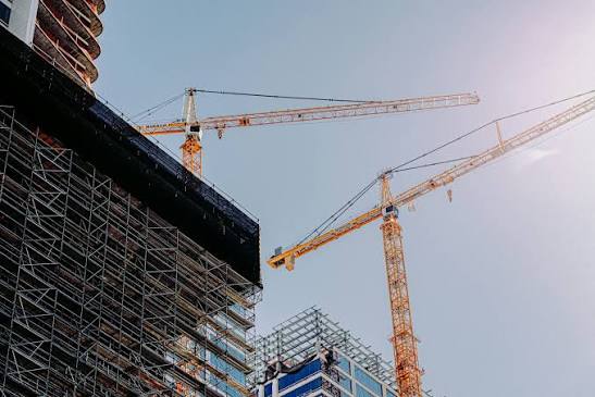 Cranes over a building under construction